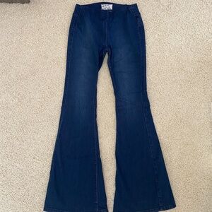 Free People Flared Jeans in Dark Blue.